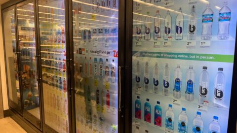 Cooler doors with screens at a Walgreens.