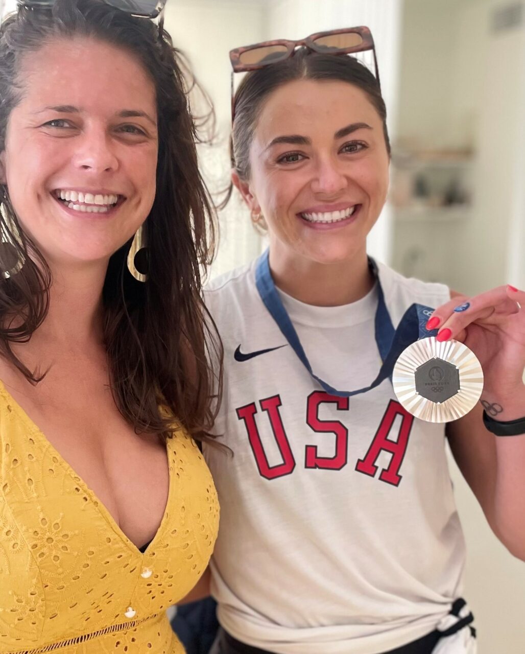 AI couldn't create this moment either...that being Olympic silver medalist in synchronized diving, Kassidy Cook with her medal (and the author).